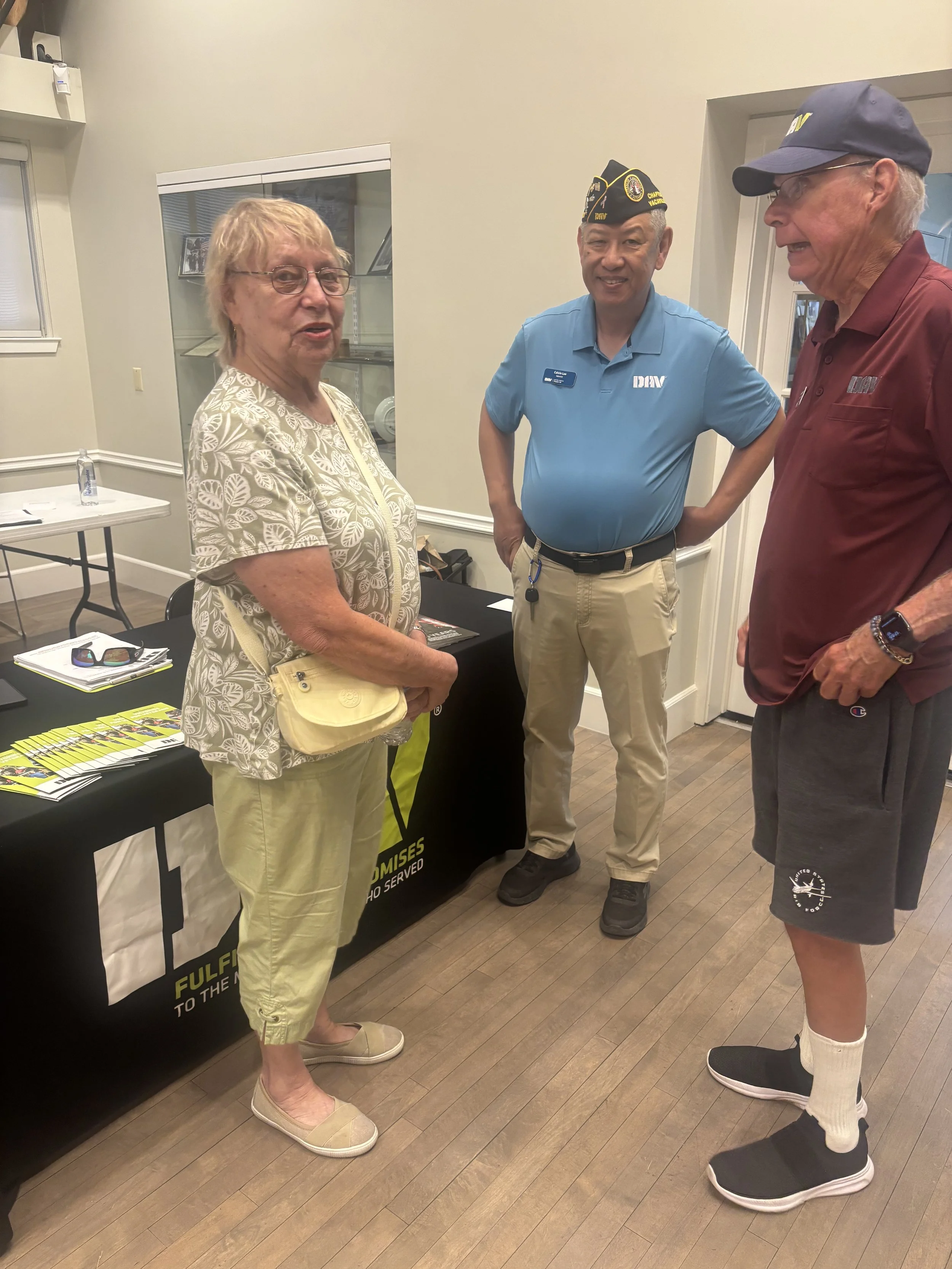 Commander Bonita Knuckles, 1st Vice Commander Mark Raymond, and Adjutant Calvin Lee talking with Nurse (Vietnam-Era Veteran) Gayle Minkler.
