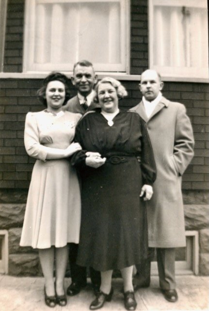 Mildred, Otto, Libby and Otto's brother George, in the back of the Middle Village house, 1942.