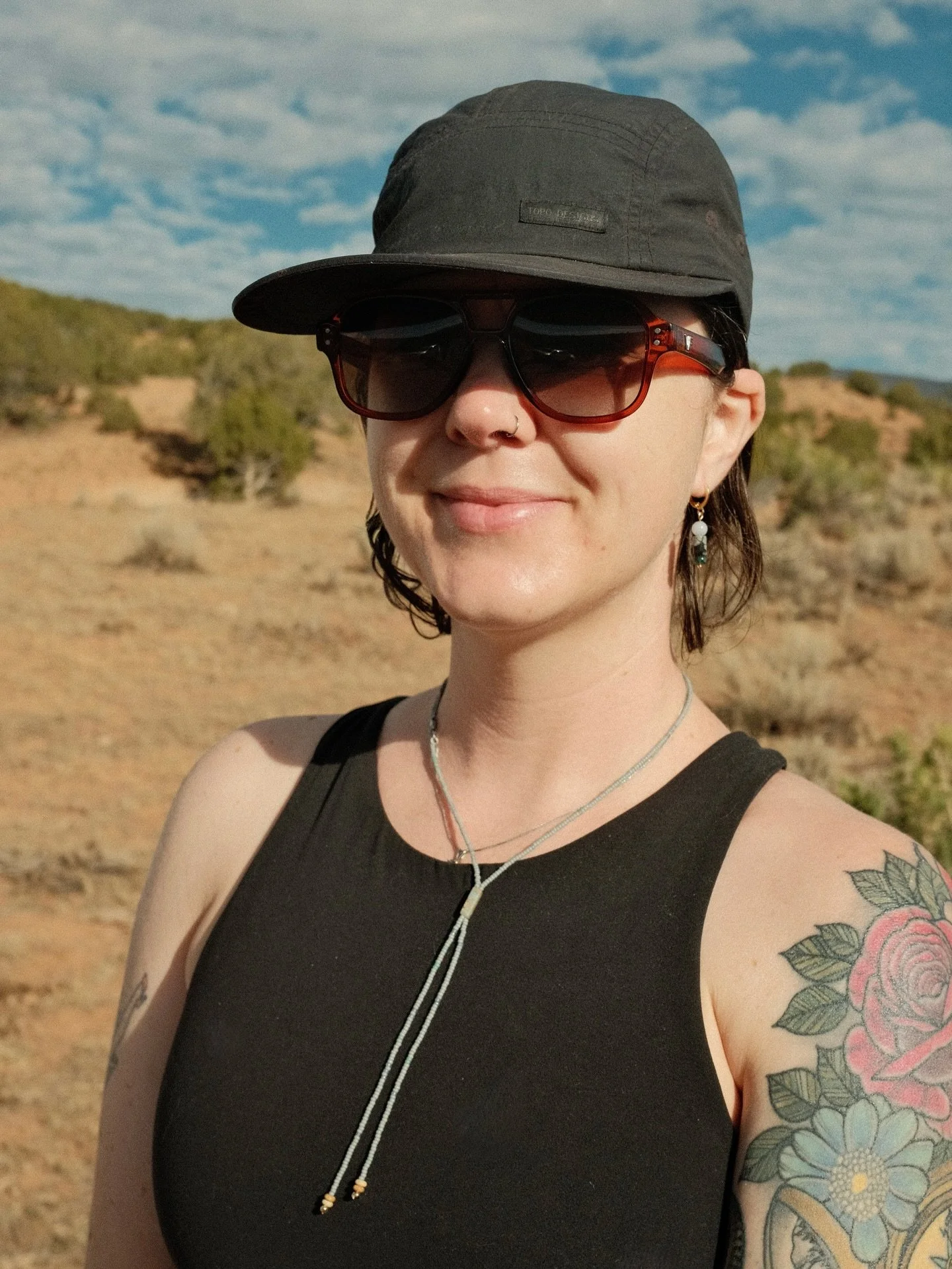 Kayla in her beaded bolo + snowflake obsidian earrings 🩵