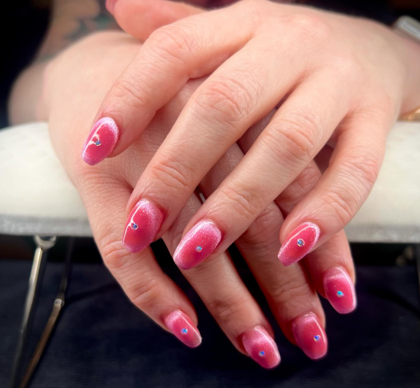 Pink chrome gel manicure with gemstone accents created at GROW Salon & Spa in Brookside Kansas City.