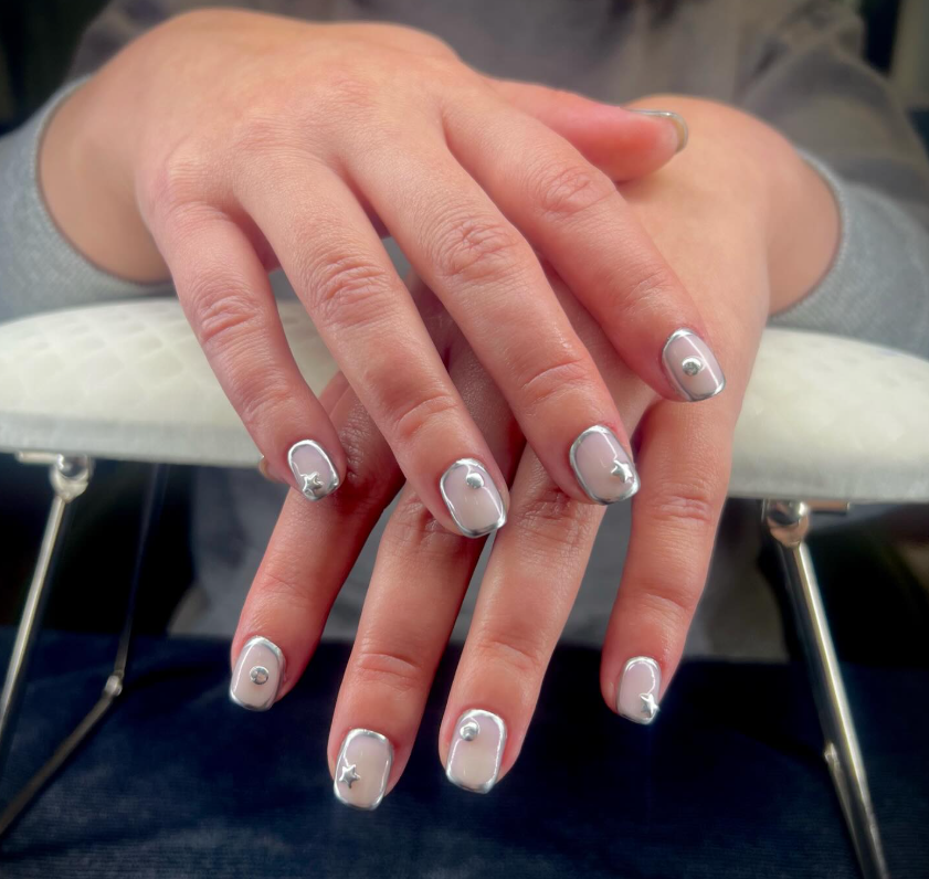 Neutral gel manicure with soft shimmer and delicate nail art at GROW Salon & Spa in Brookside Kansas City.