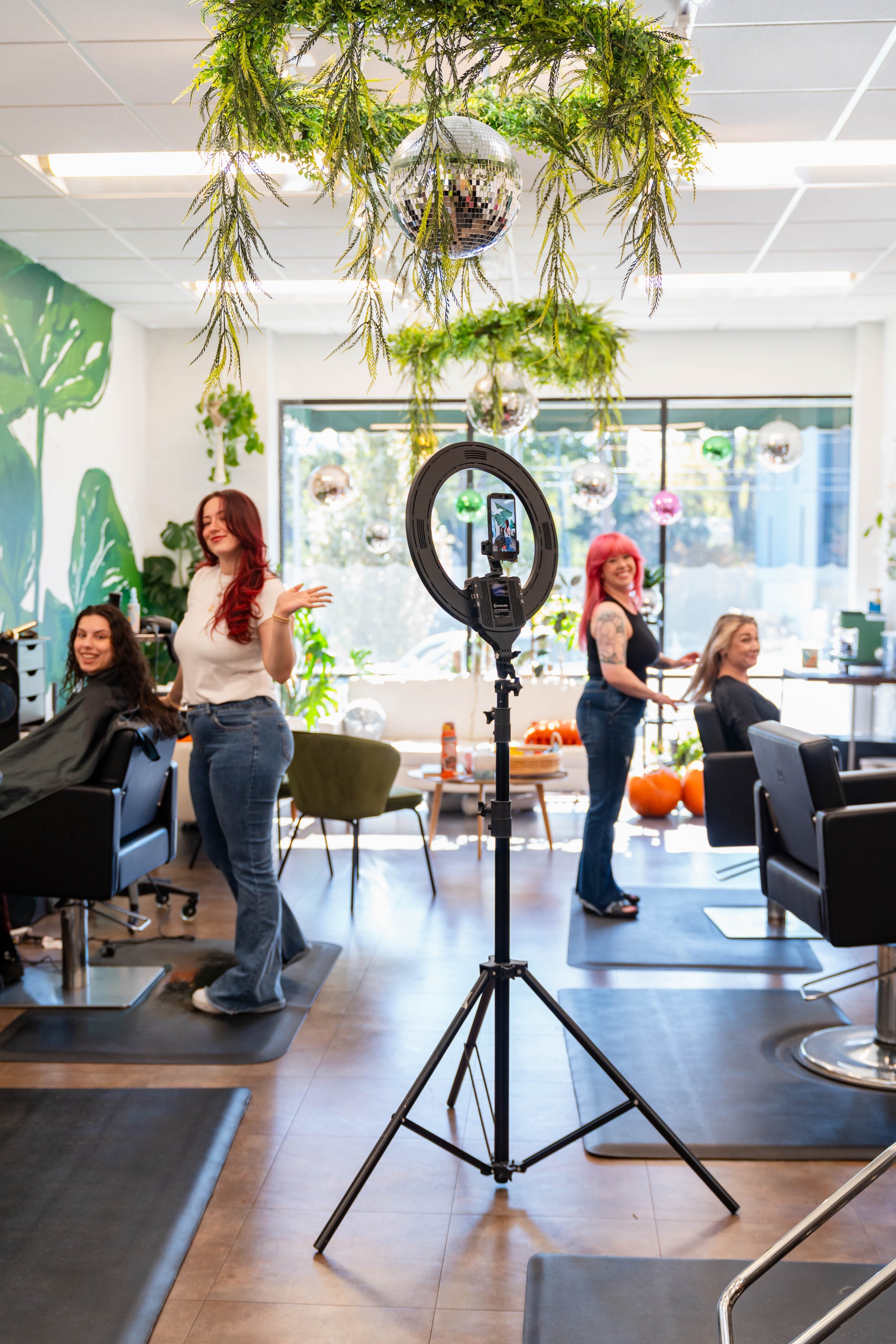 Salon stylists working with clients inside GROW Salon & Spa in Brookside Kansas City Missouri