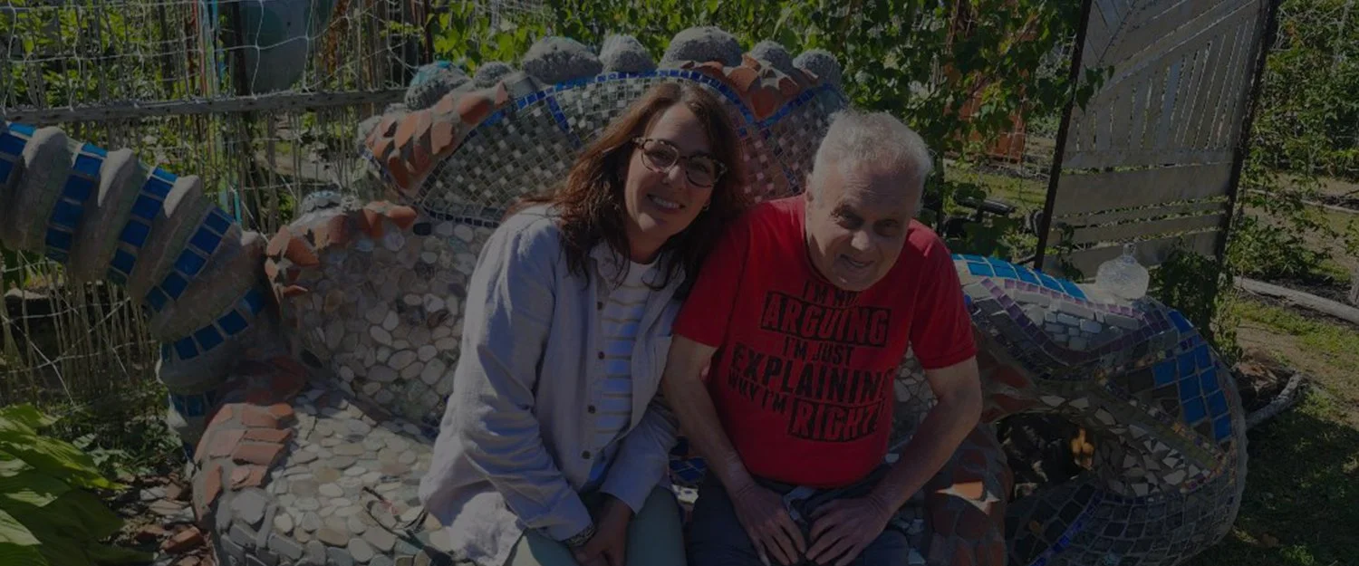 Man and woman smiling for the camera.