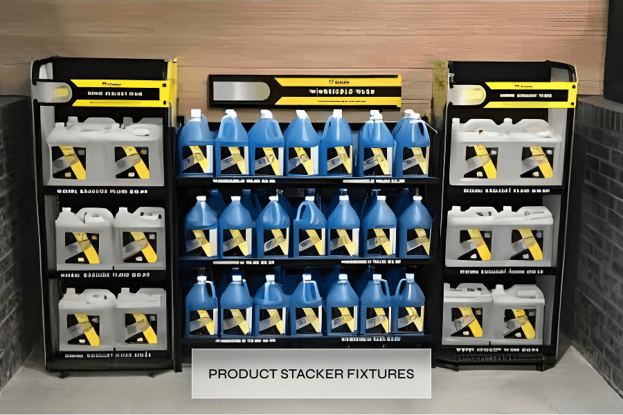 Shelf display of white and blue cleaning product containers labeled 'Product Stacker Fixtures' in a store.