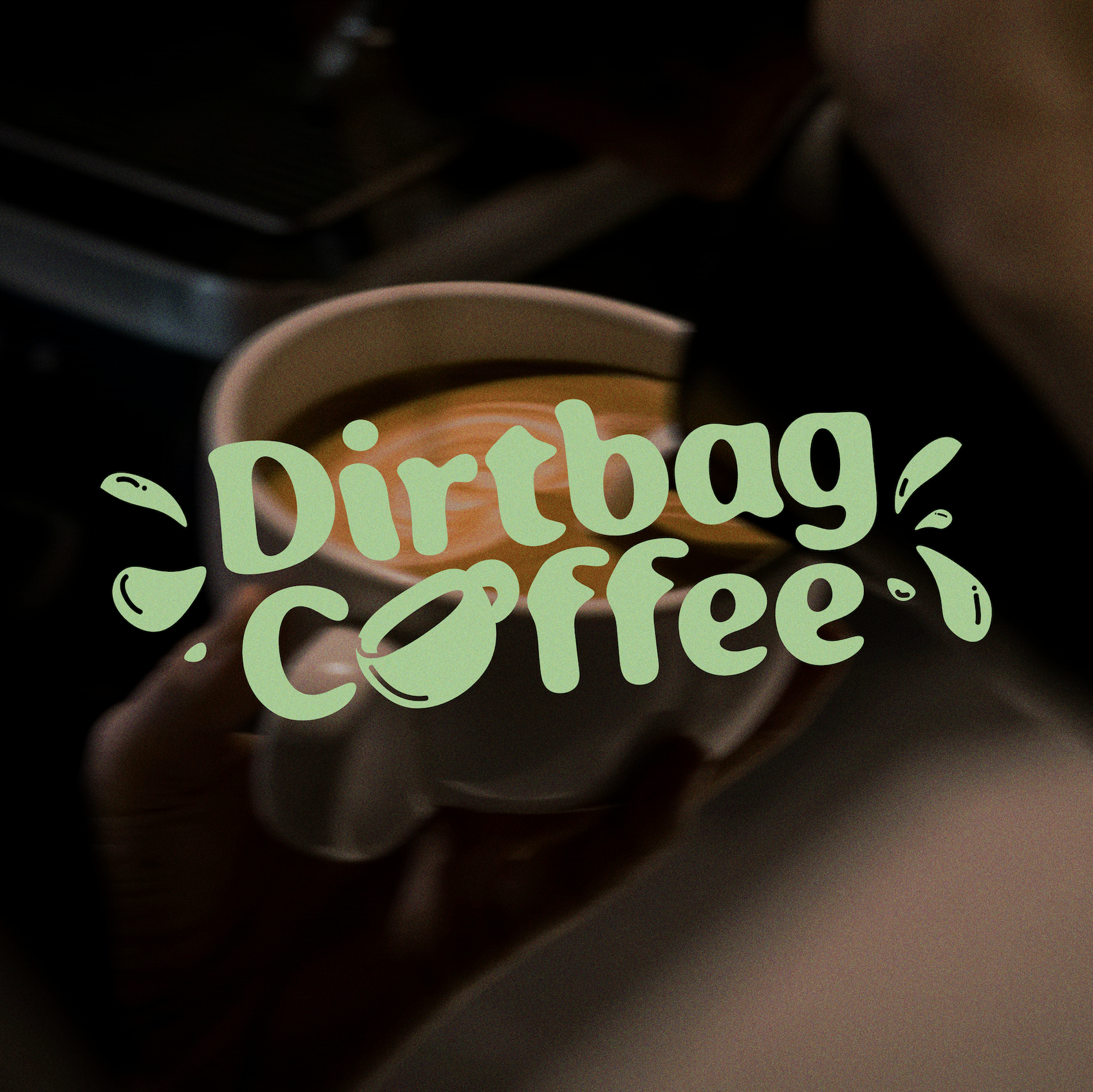 A hand holding a coffee cup with latte art, overlaid with the text 'Dirtbag Coffee' in green, stylized font, with coffee bean and splash illustrations.