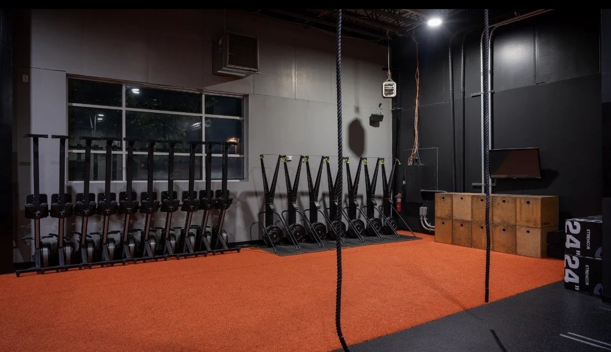 CrossFit training area with plyo boxes at QC Fit West Charlotte.