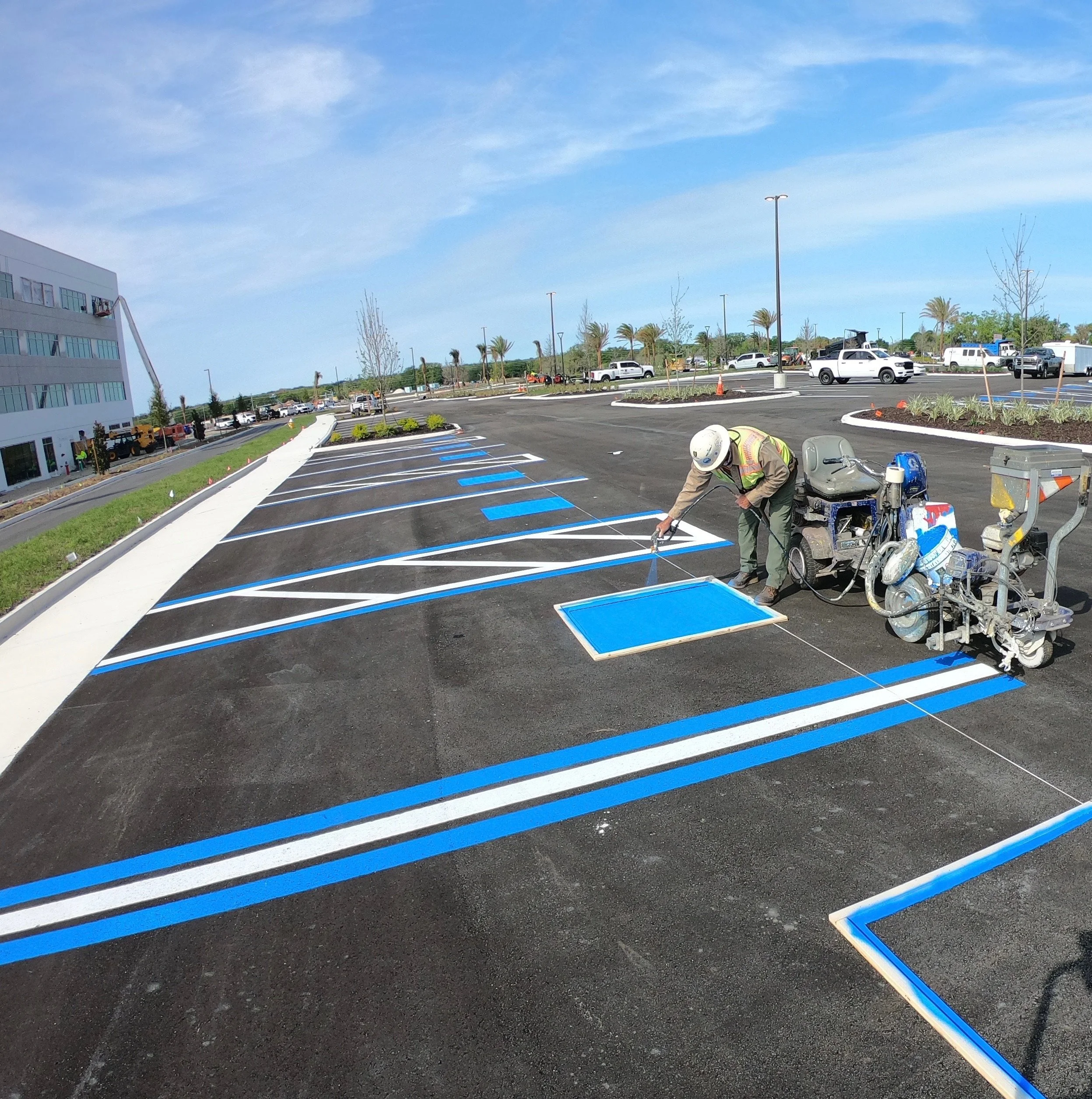 Handicap parking spot markings being applied