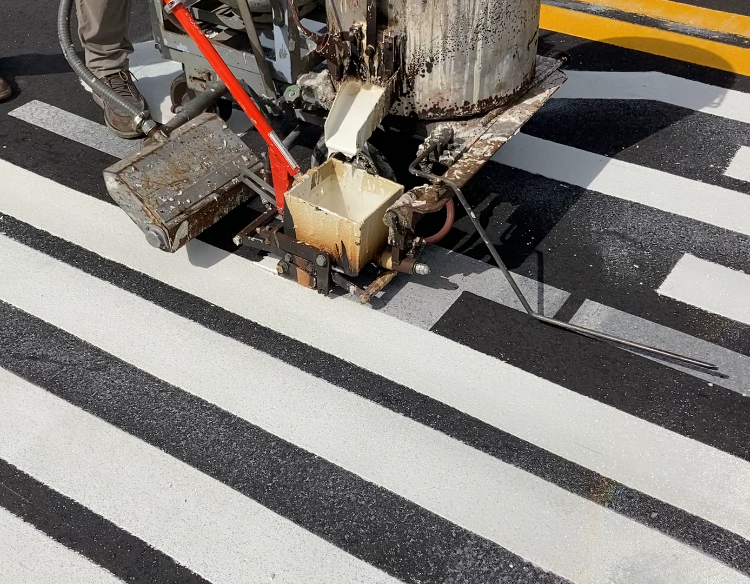 Application of thermoplastic markings that will last much longer than standard traffic paint.