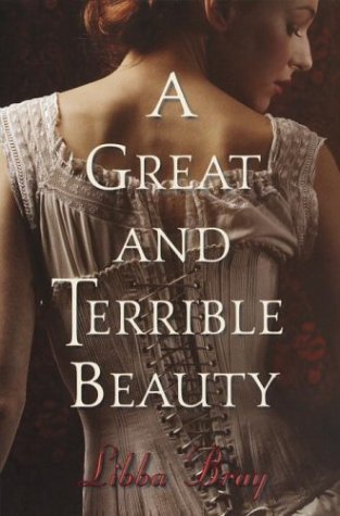 Close-up of a woman in a beige, vintage-style dress with lace, looking downward against a dark background, with the text "A Great and Terrible Beauty" and the author's name "Libba Bray" overlaid.