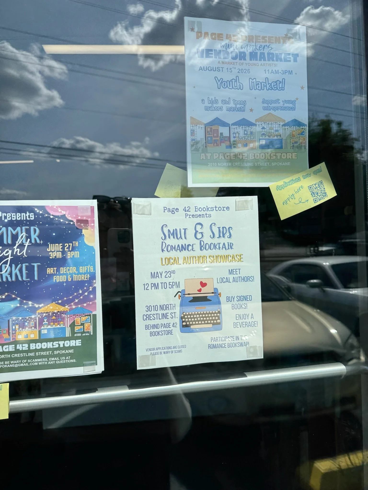 Smut and Sips flyer in the window at Page 42 bookstore in spokane