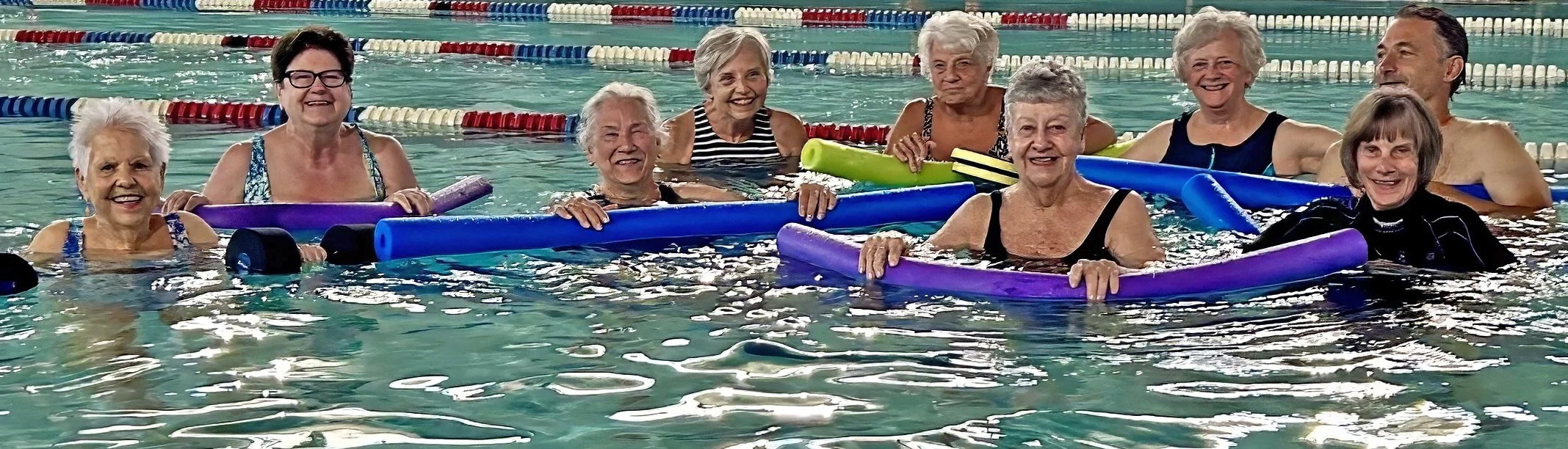 Aqua Fitness members smiling in the YWCA pool.