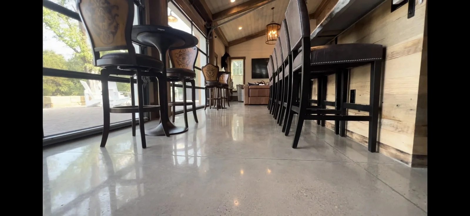 Polished concrete floor in a bar and lounge, installed by J&G Epoxy Coatings