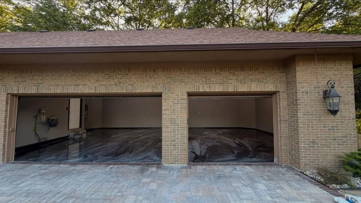 Metallic epoxy garage floor by J&G Epoxy Coatings, brick garage with the door open, central Ohio