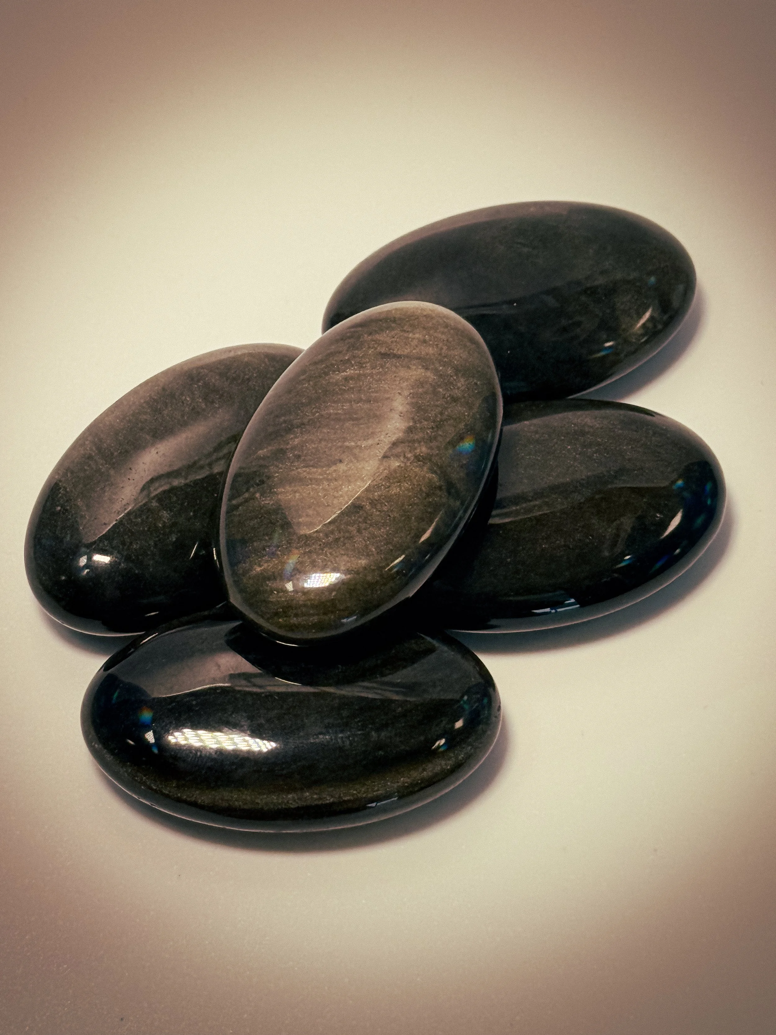 Silver and Gold Obsidian Palm Stone