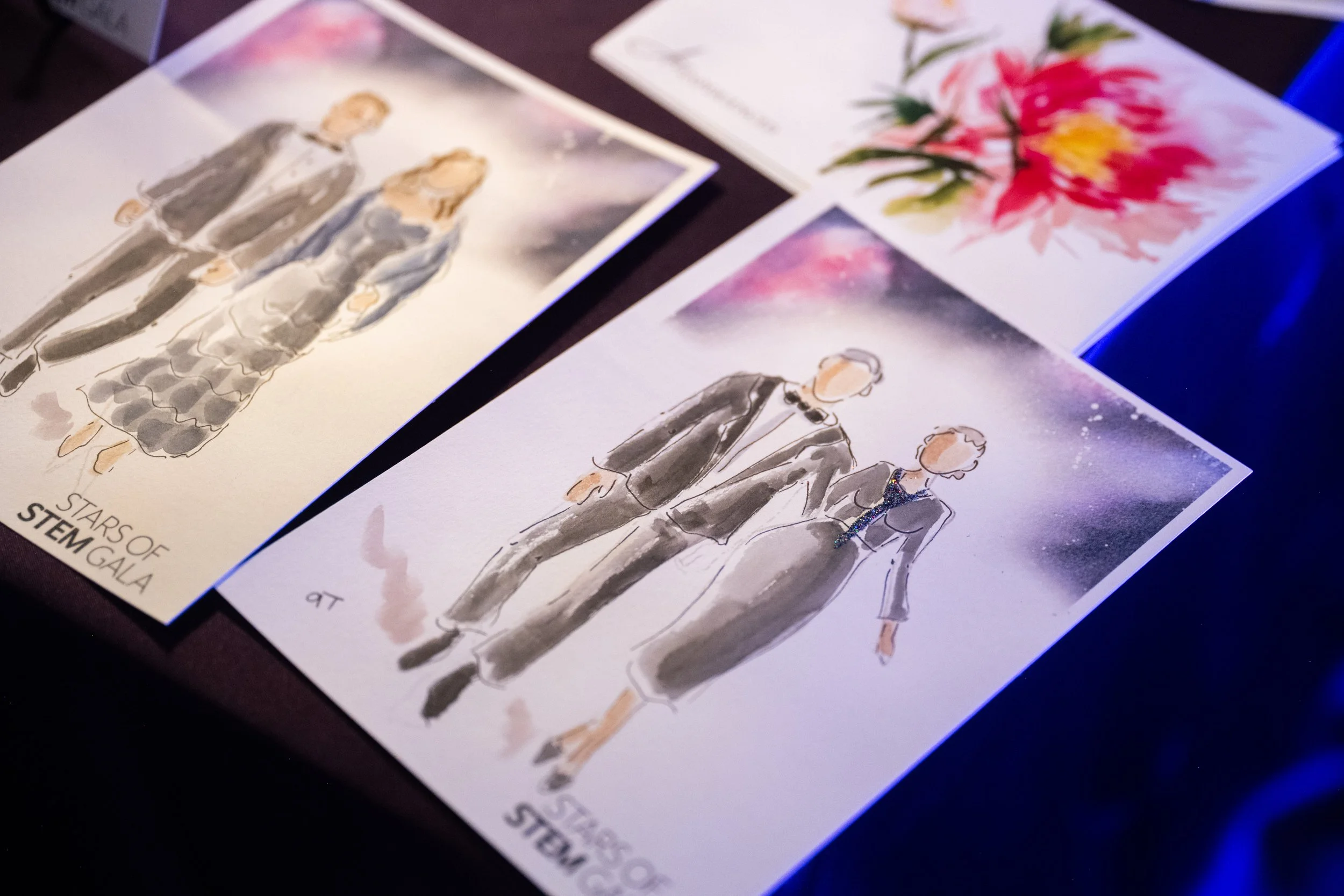 a close up of a watercolor portrait on guests at a STEM event, the woman painted is wearing a sparkly tie
