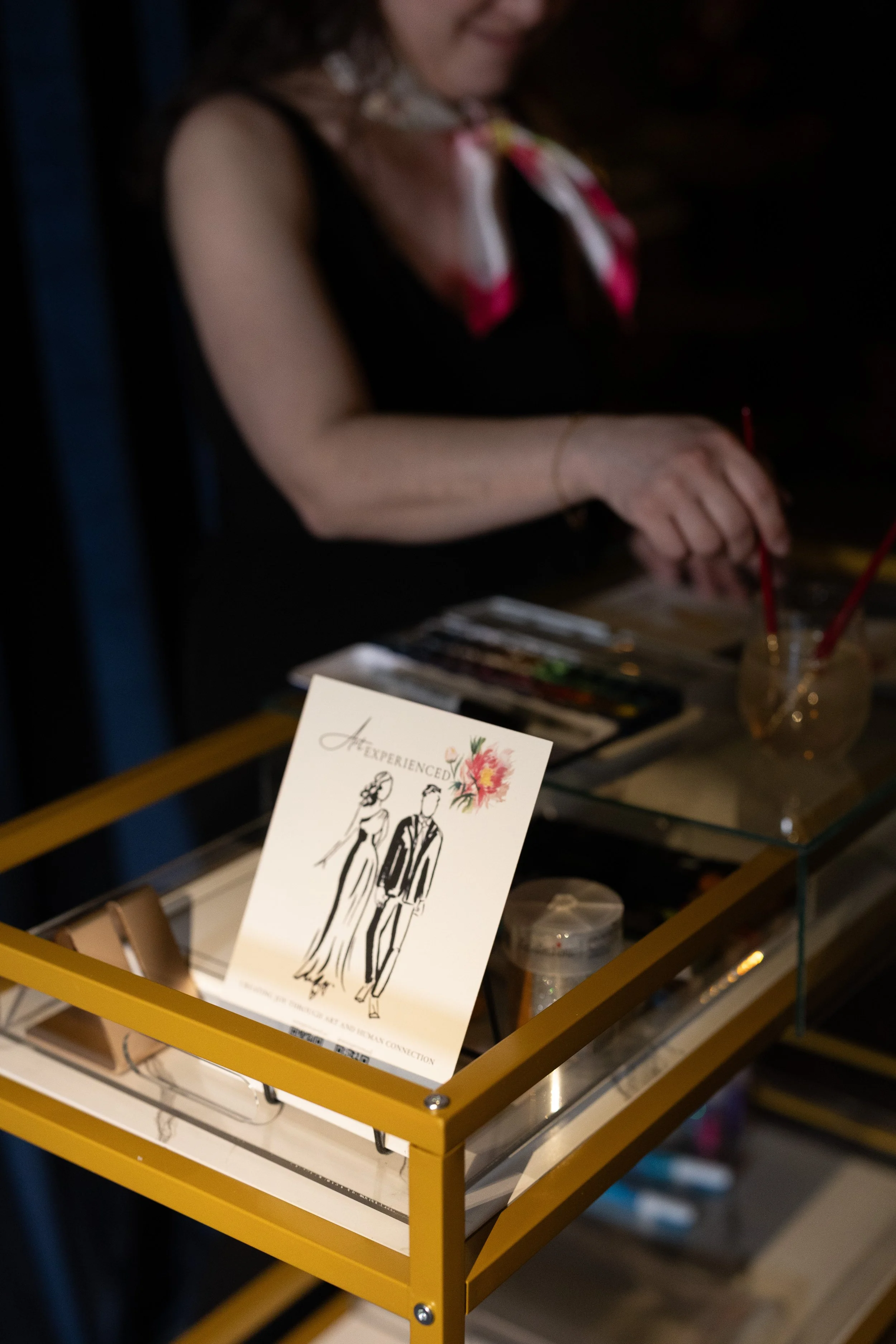 Artist sets up supplies on a roaming cart