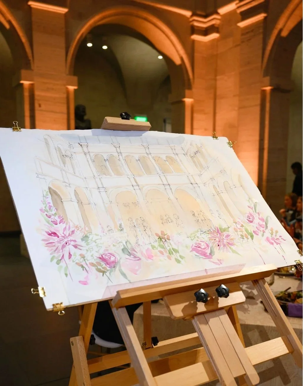 a large watercolor painting of an event done live during the event at the venue