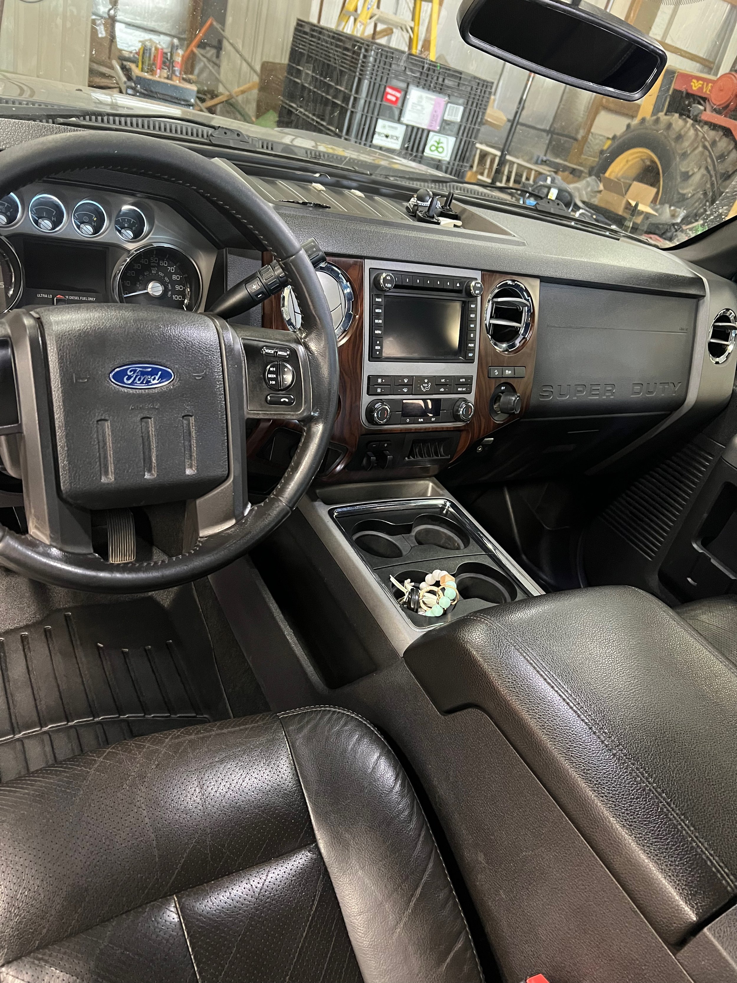 Interior detailing transformation highlighting cleaned and conditioned leather seats."