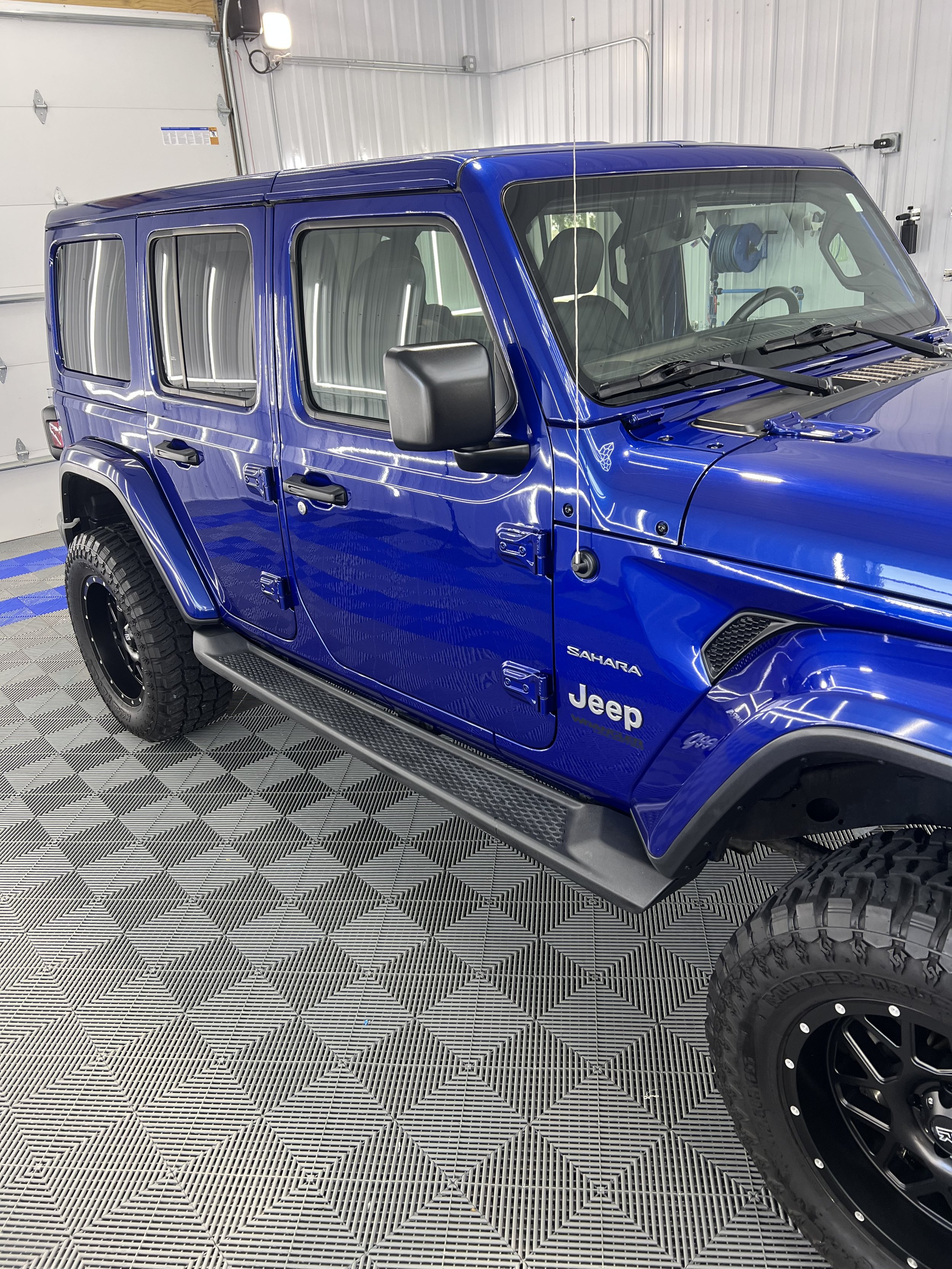 Ceramic coating on this jeeps exterior showcasing restored paint shine.