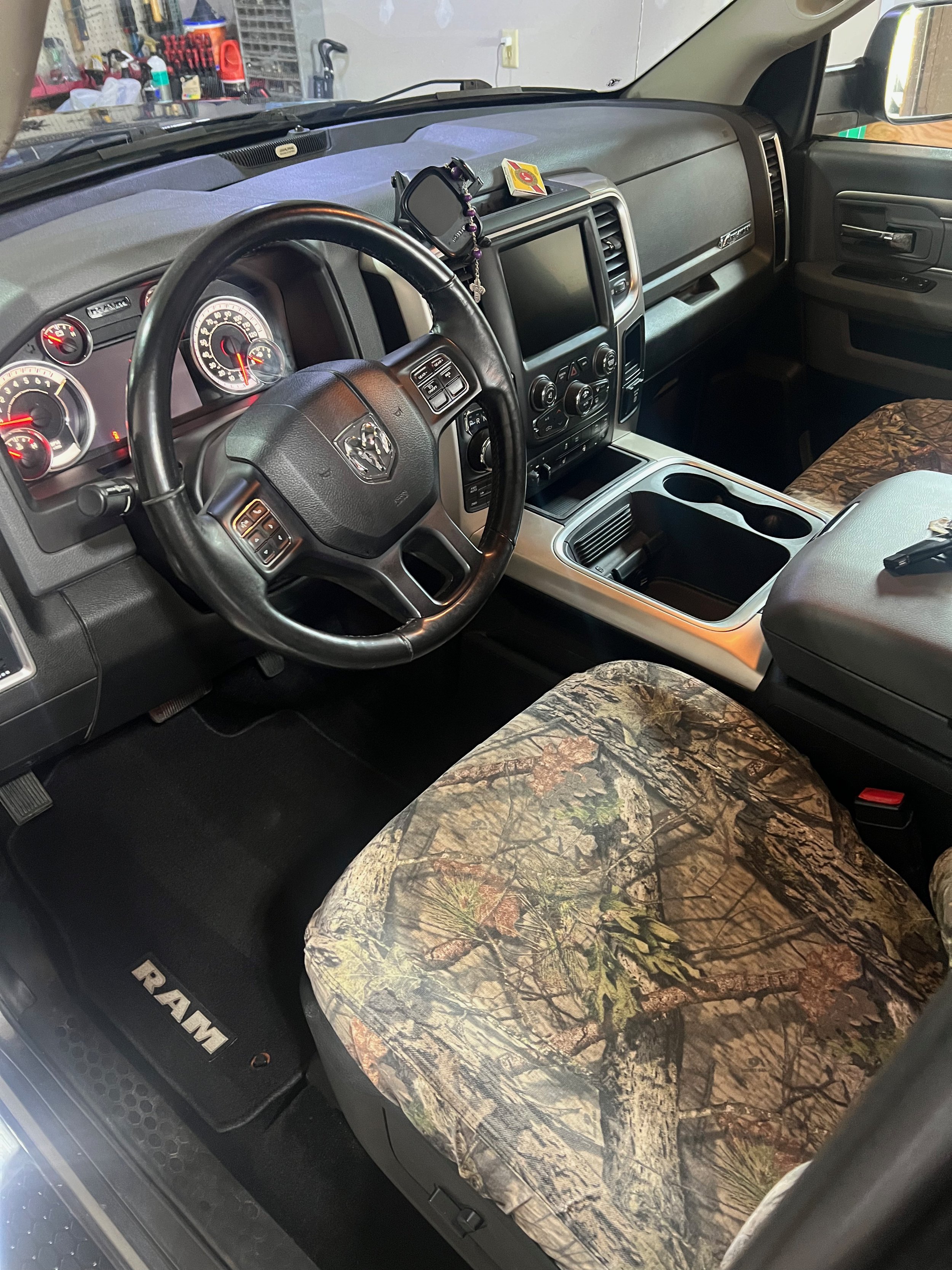 interior detail showing off clean carpets and seats and a fully dressed dashboard