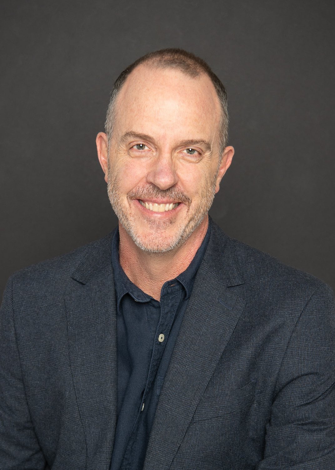 Tim Bradfield Managing Director & Founder