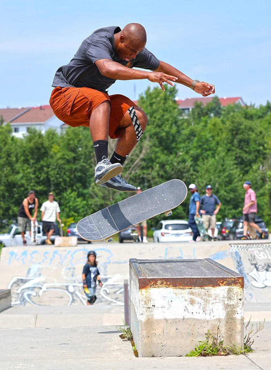 Olympic Skateboard Cordano Russell does a big 360 flip 50-50 at the Minnow Lake Skatepark.