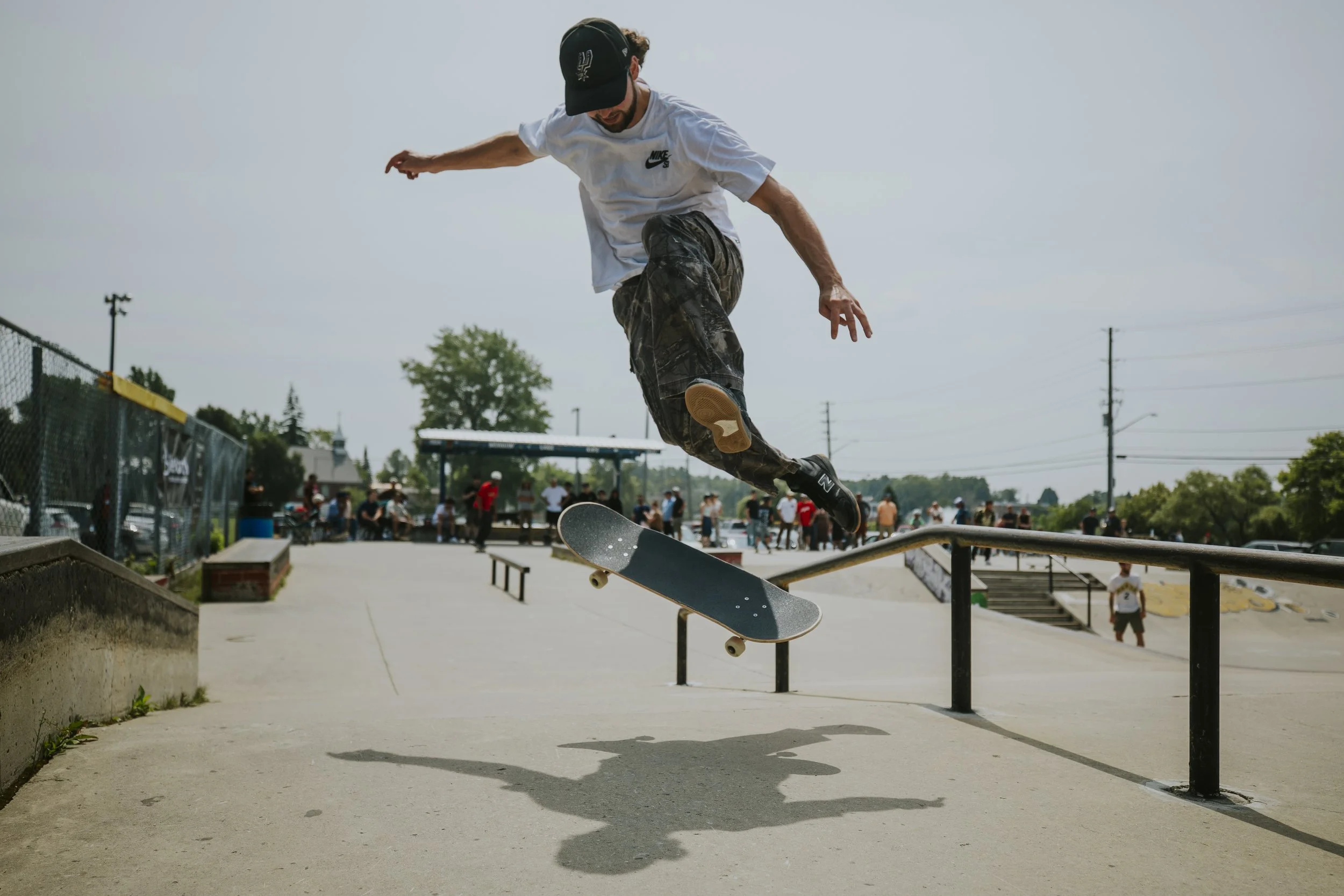 Ryan Clusiau pops a 360 flip at the Minnow Lake Skatepark. Photo by Juan Echavarría.