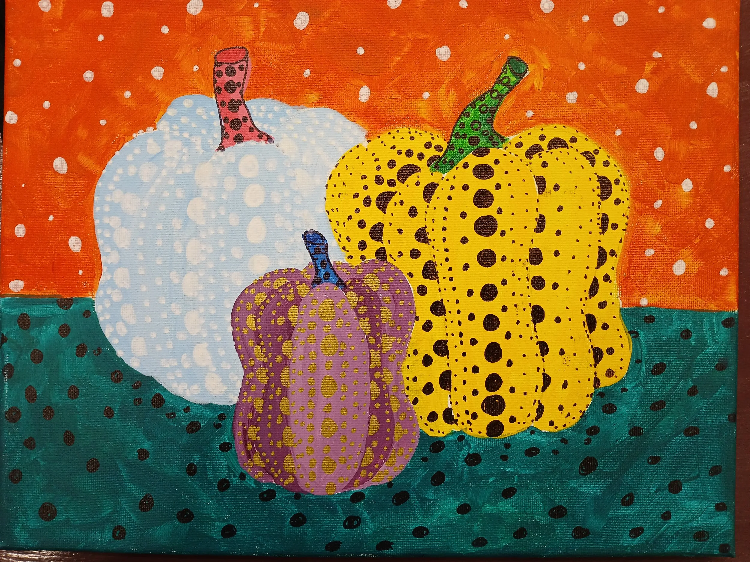 A painting of 3 Pumpkins in blue, purple and yellow with paint pens highlighting dots 