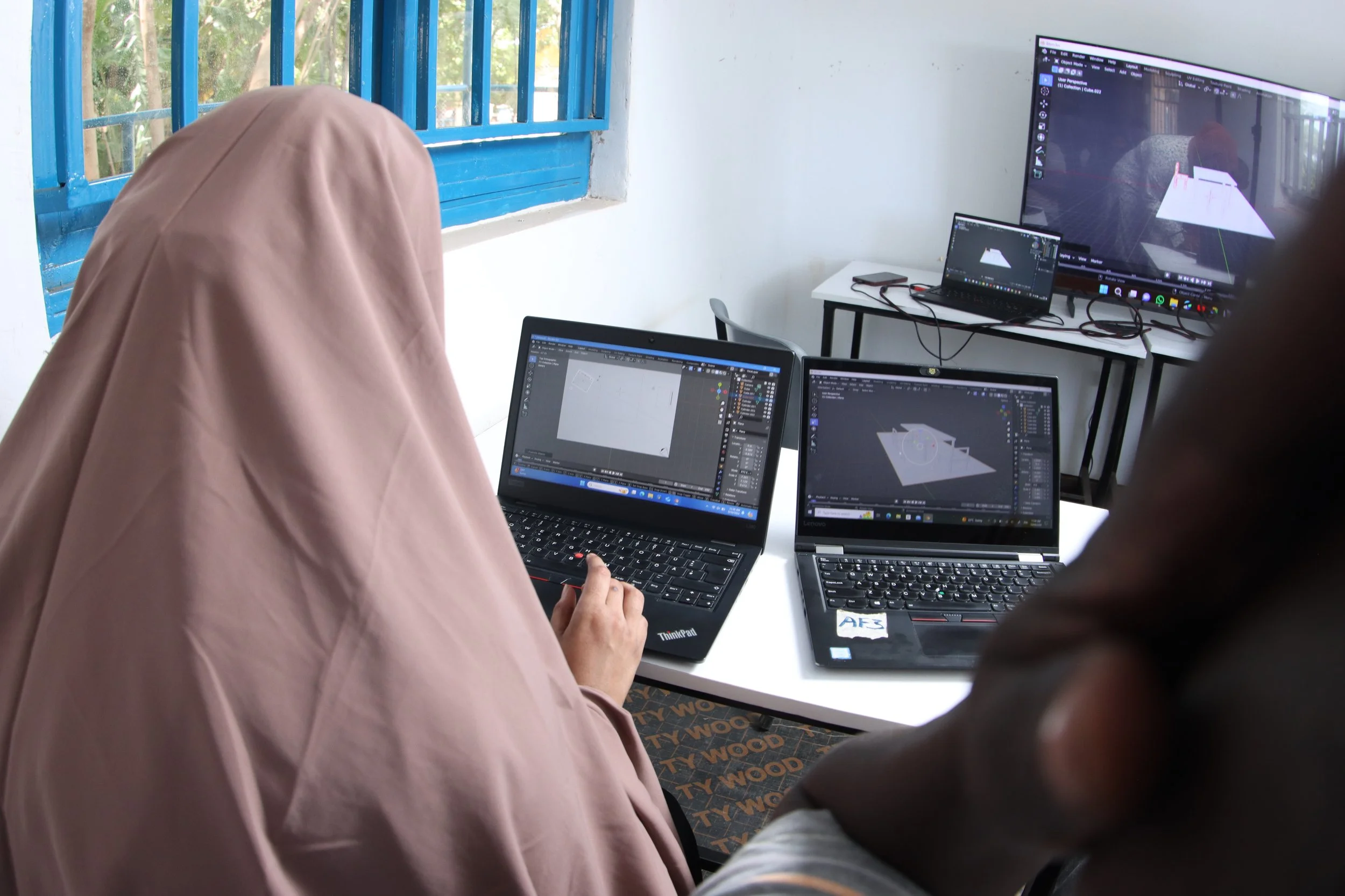 3d modelling students of the creative gateway program working on their laptops at the freelance hub in kakuma refugee camp