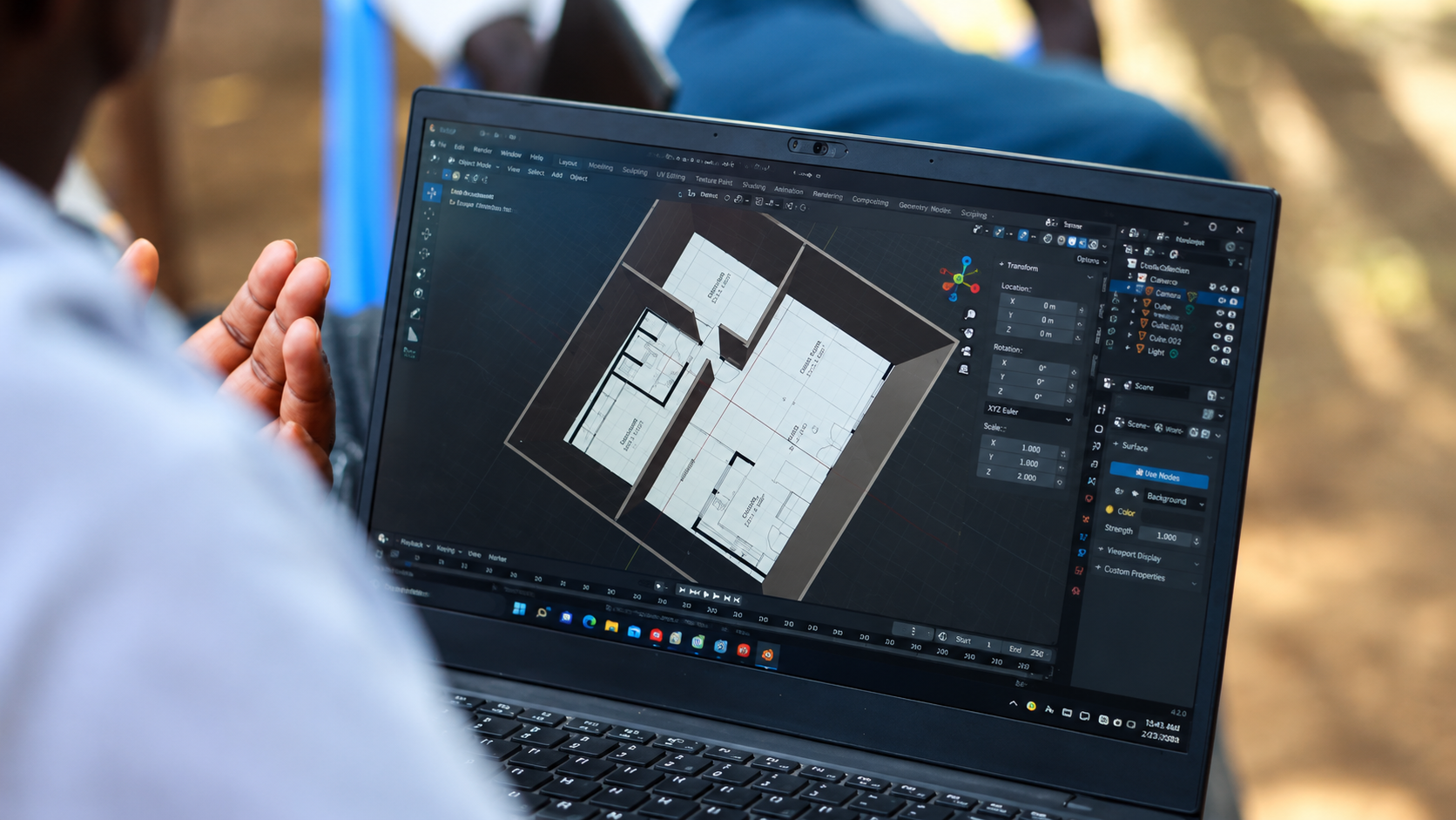 Young Creative Gateway participant working on a 3D architectural model on a laptop during 3D modelling and digital skills training in Kakuma Refugee Camp, Kenya