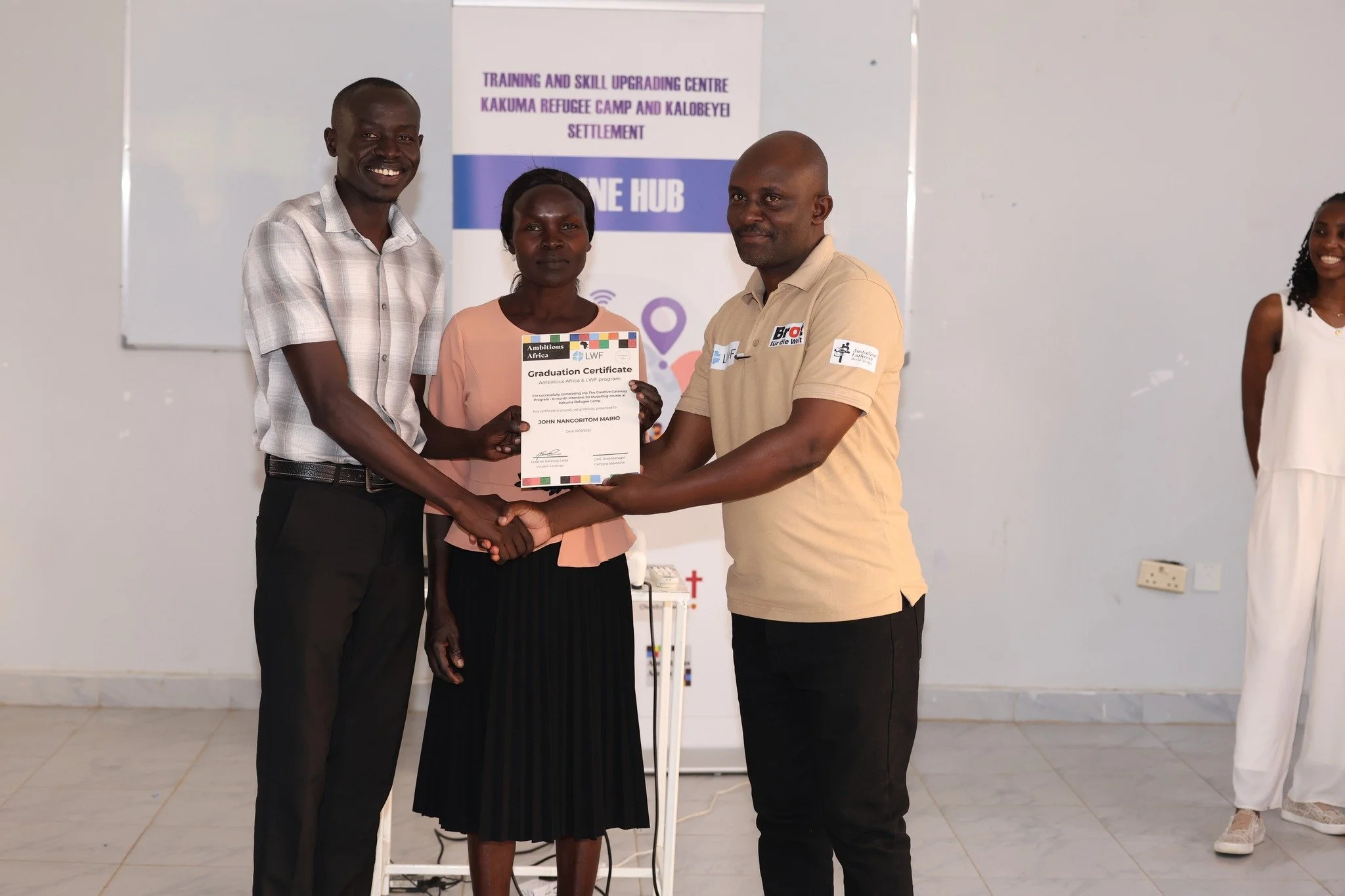 a student from the 3d modelling digital skills program in kakuma graduating with a 3D modelling certificate