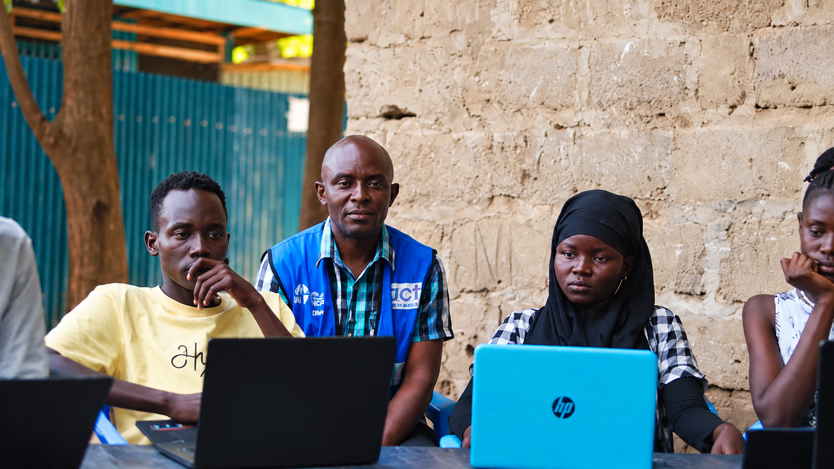 Creative Gateway digital skills empowerment programme with young people using laptops in Kakuma Refugee Camp, Kenya.