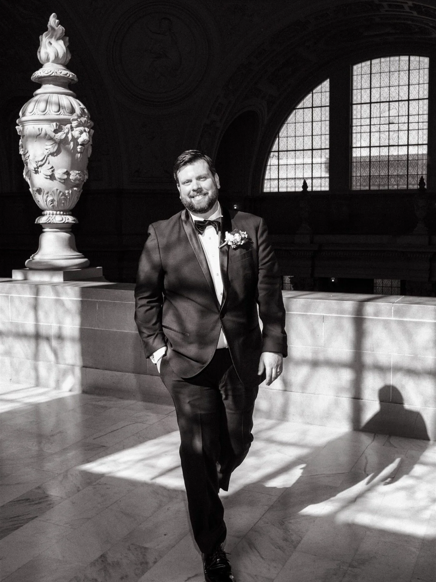 The modern groom, redefined.

A striking play of light and shadow &mdash; timeless in black and white, styled with effortless confidence &amp; a dapper edge 🖤

_____
#sanfranciscocityhall #sfwedding #cityhallwedding #editorialportrait #destinationwe