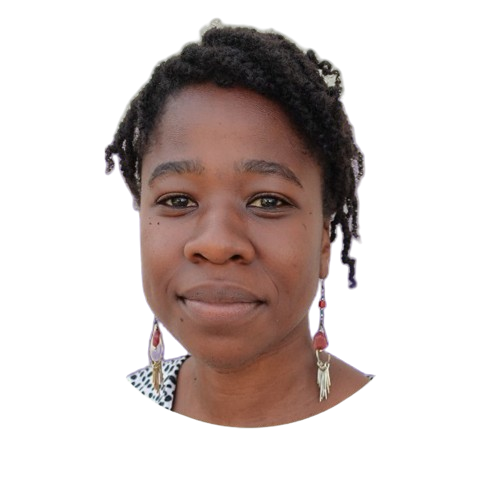 Portrait of a woman with short curly hair wearing a patterned top and colorful earrings.