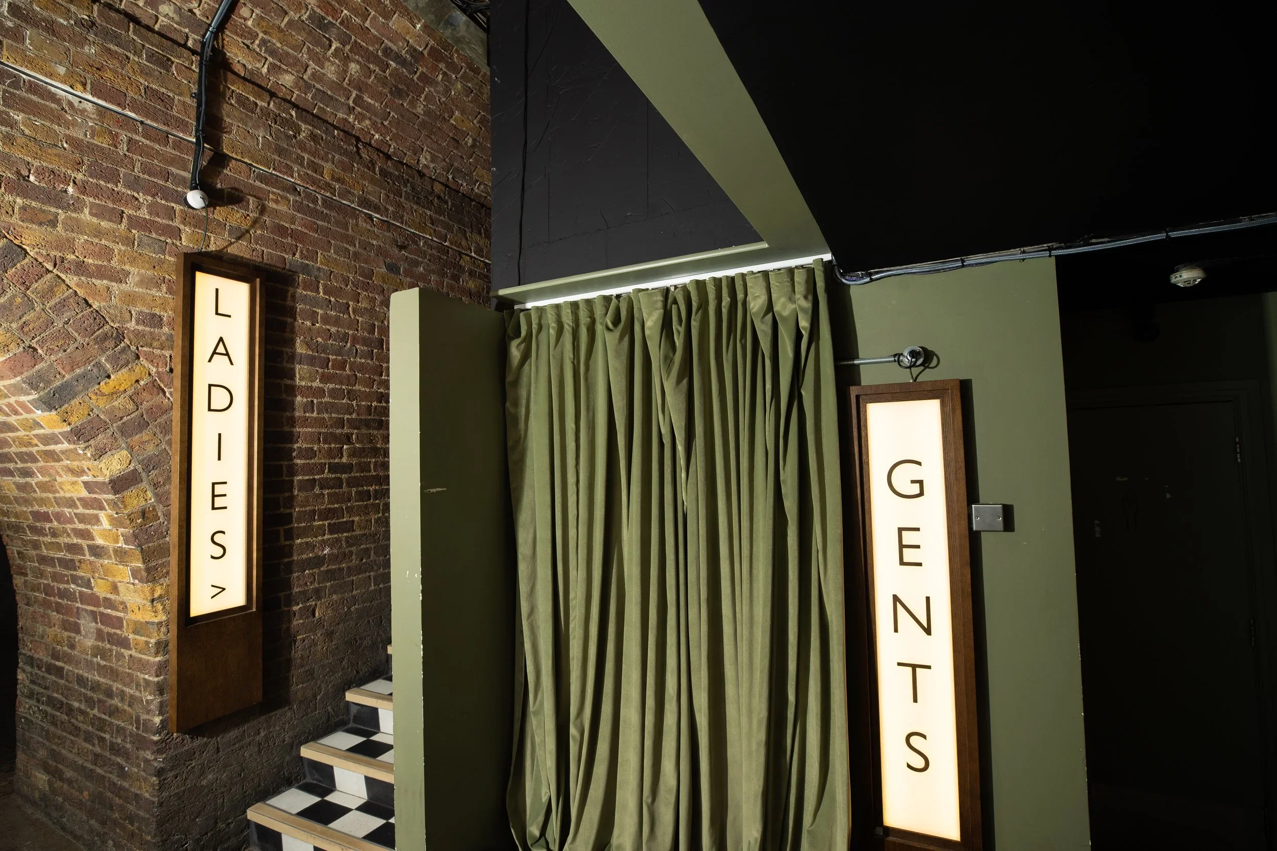 Ladies and gents toilet entrances at 83 Rivington Street