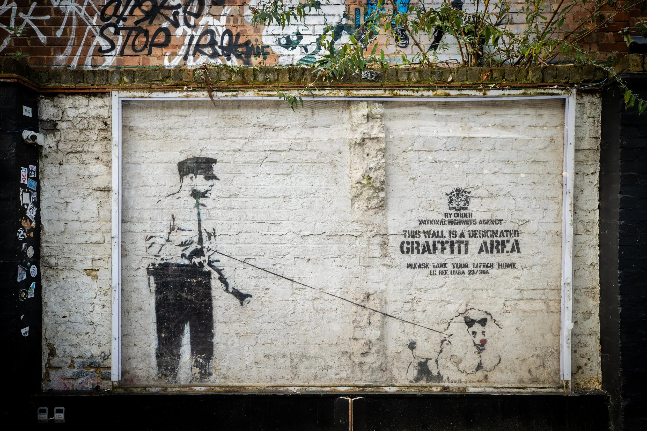 Banksy stencil artwork in the courtyard at 83 Rivington Street, Shoreditch