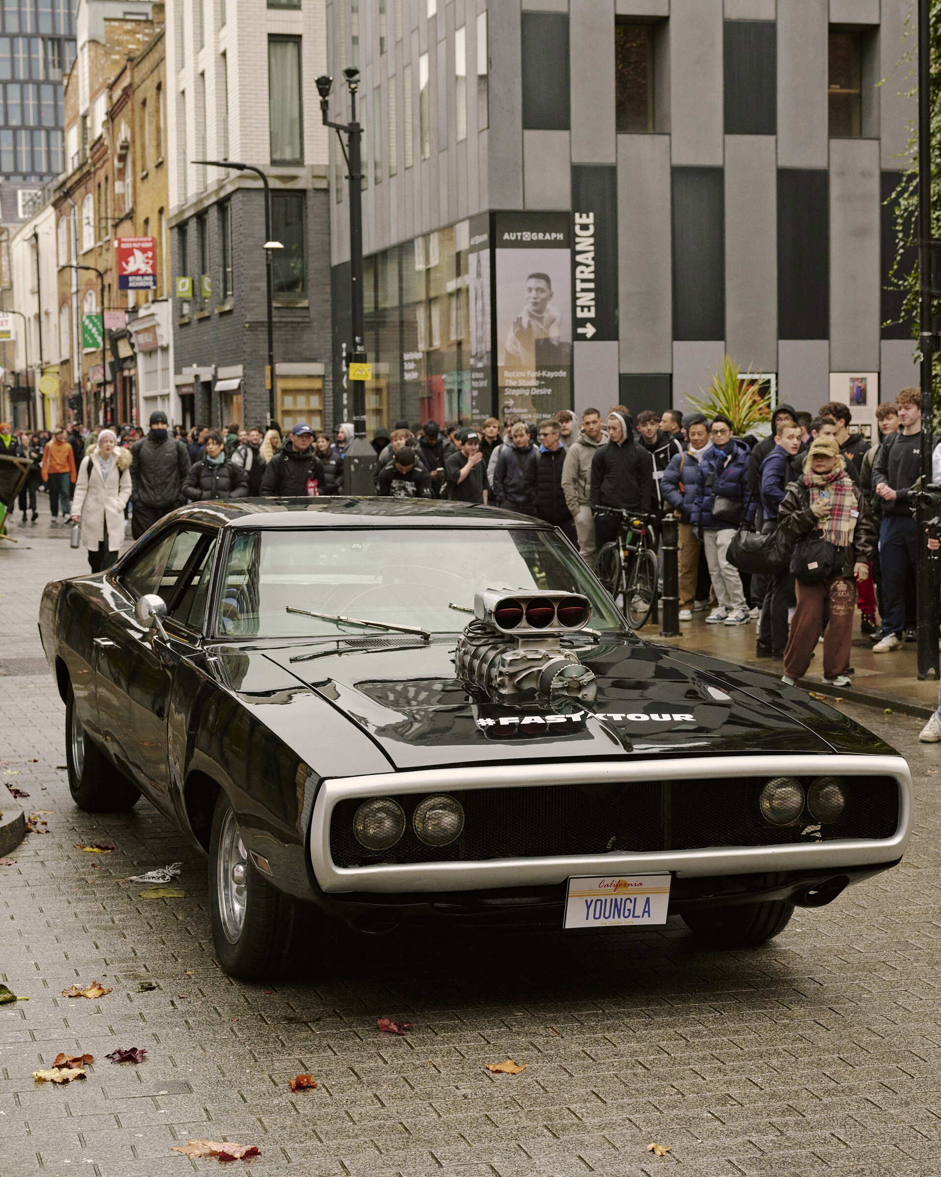 Fast & Furious car at Young LA brand activation at 83 Rivington Street black car American car crowd looking