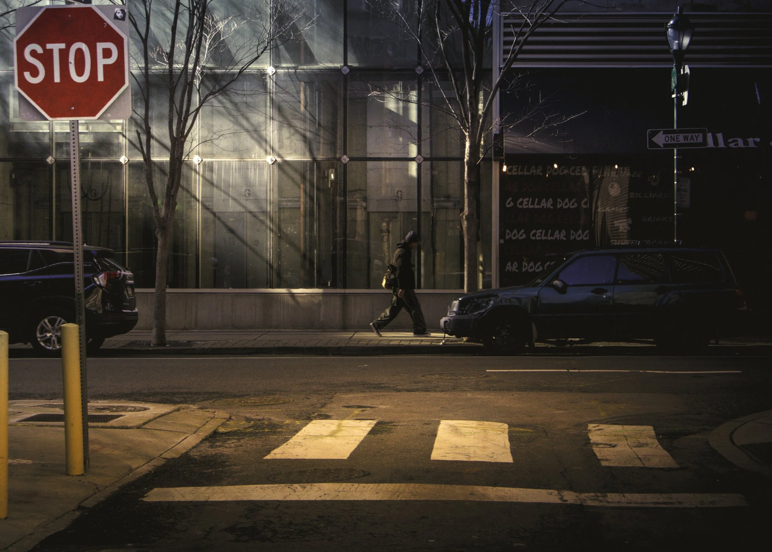 One Way Home
Building shadows falling across a downtown Philadelphia street in late morning light.