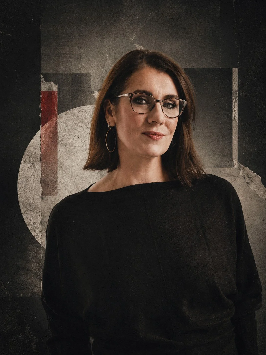 A woman with shoulder-length brown hair, wearing glasses, earrings, and a black top, standing against a textured background with geometric shapes.