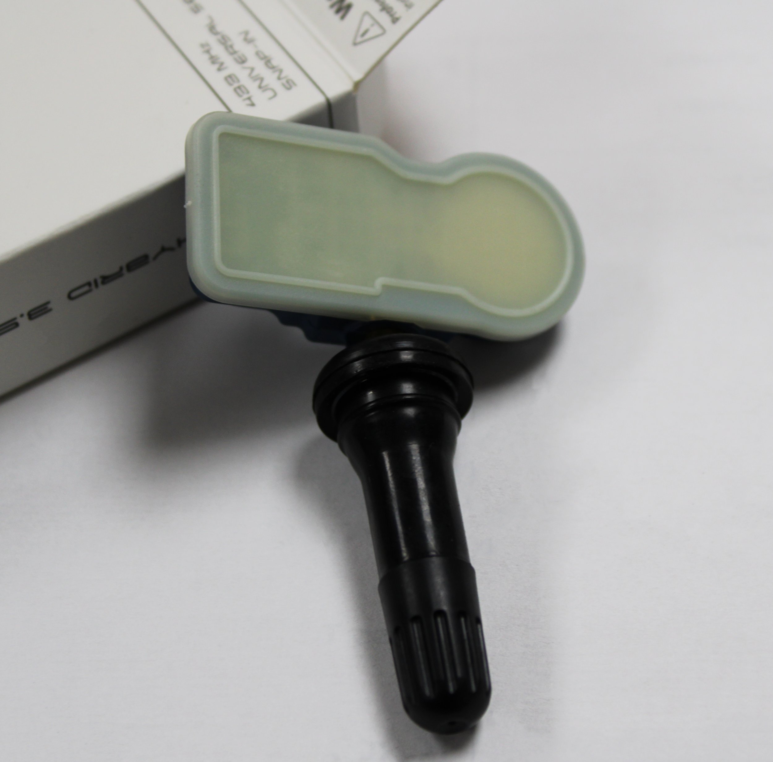 TPMS Sensor on a white background.
