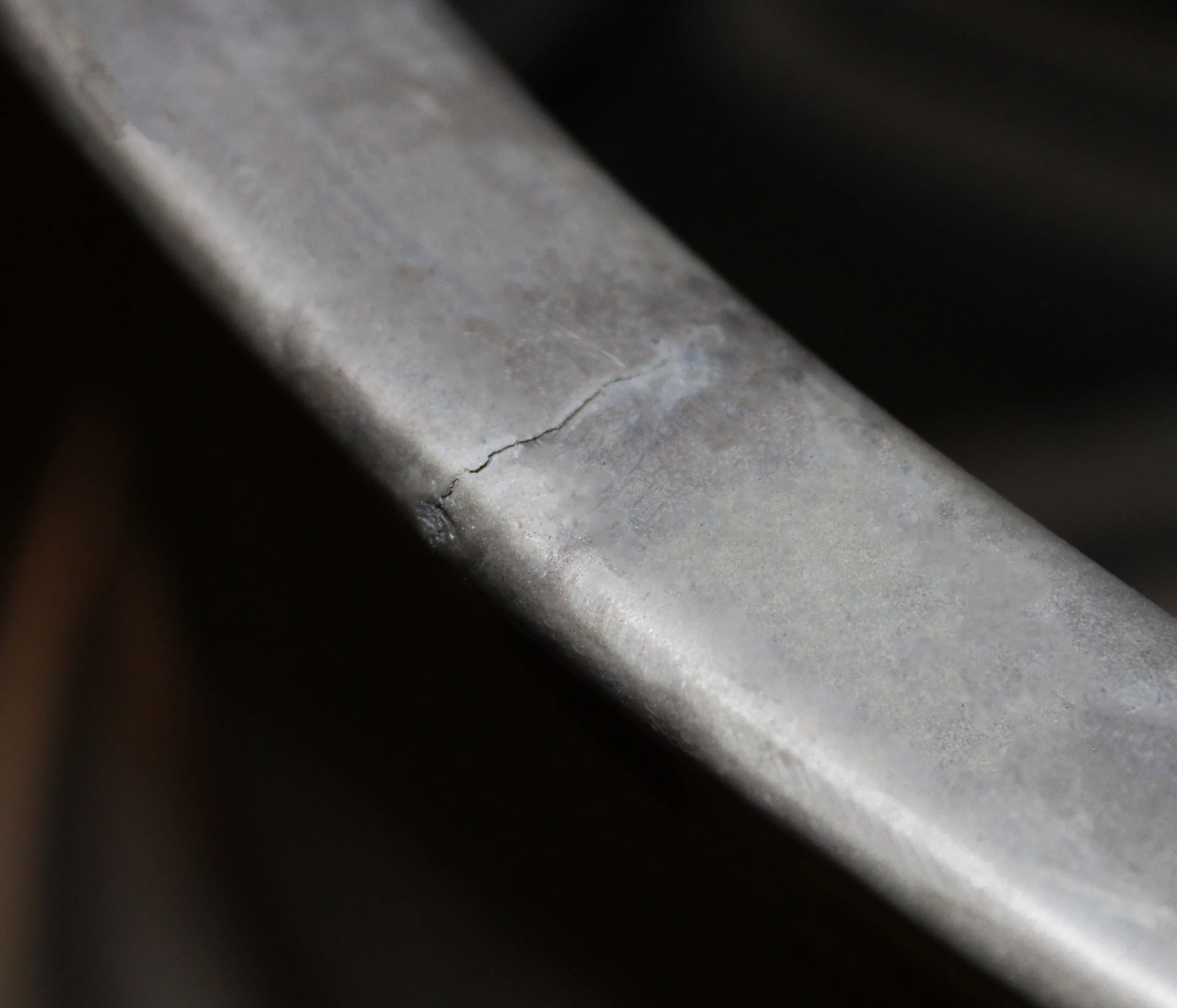 Close-up of an alloy with a crack needing a weld.