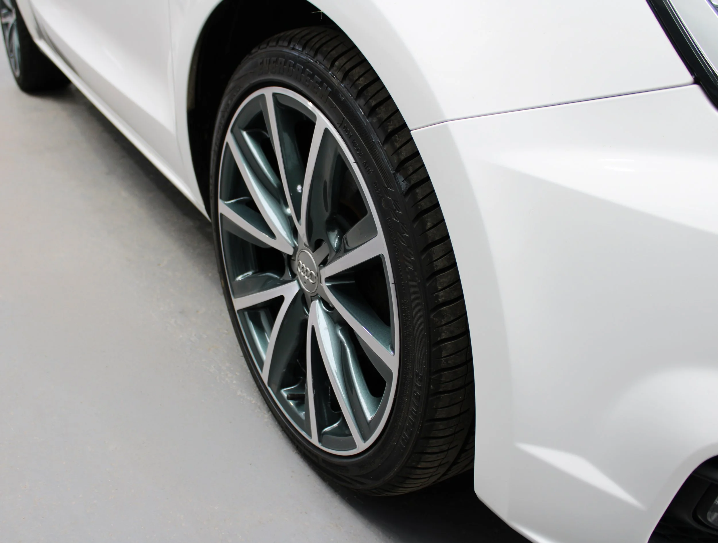 a wheel after a custom colour powder coat refurbishment and diamond cut finish