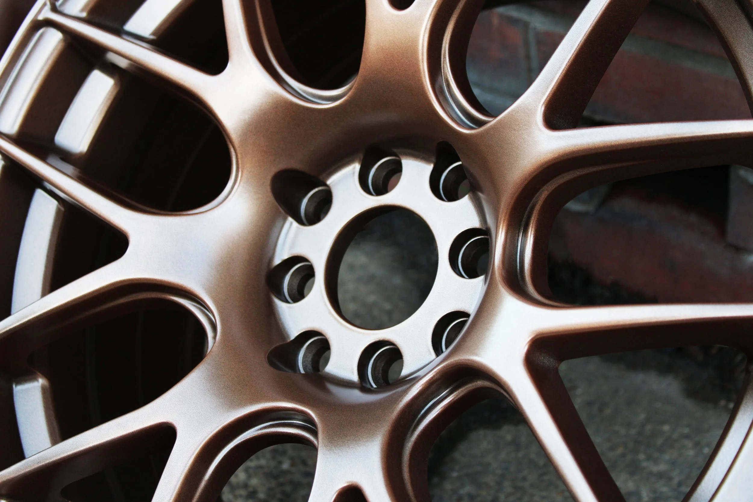A wheel powder coated in performance bronze
