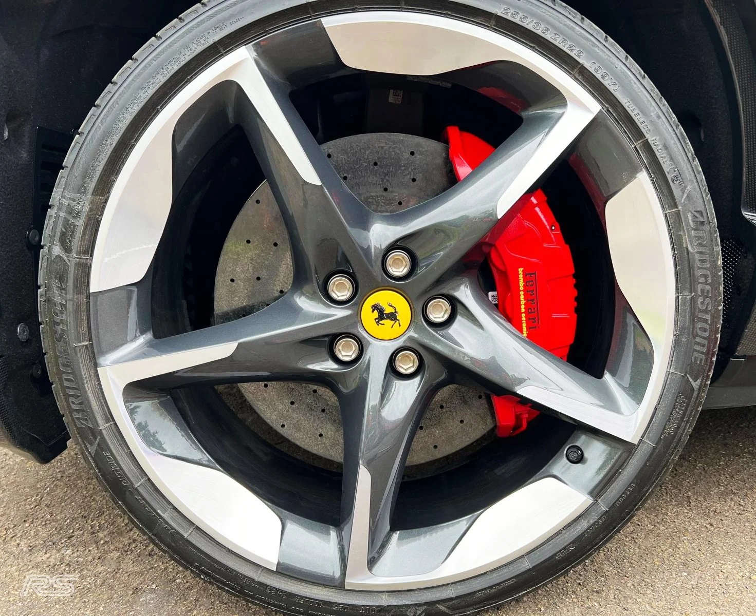 A shot of a freshly repaired and diamond cut ferrari wheel completed onsite