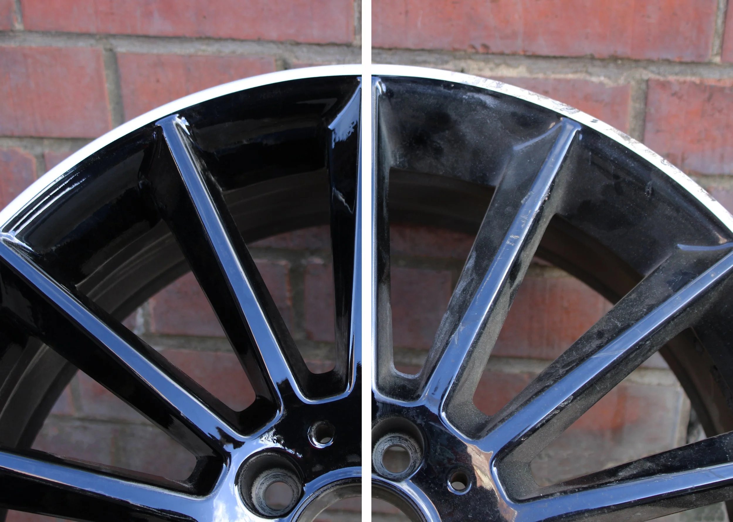 Close-up of a black alloy wheel with a red brick wall in the background with the left side SMART repaired and the right side damaged and scuffed.