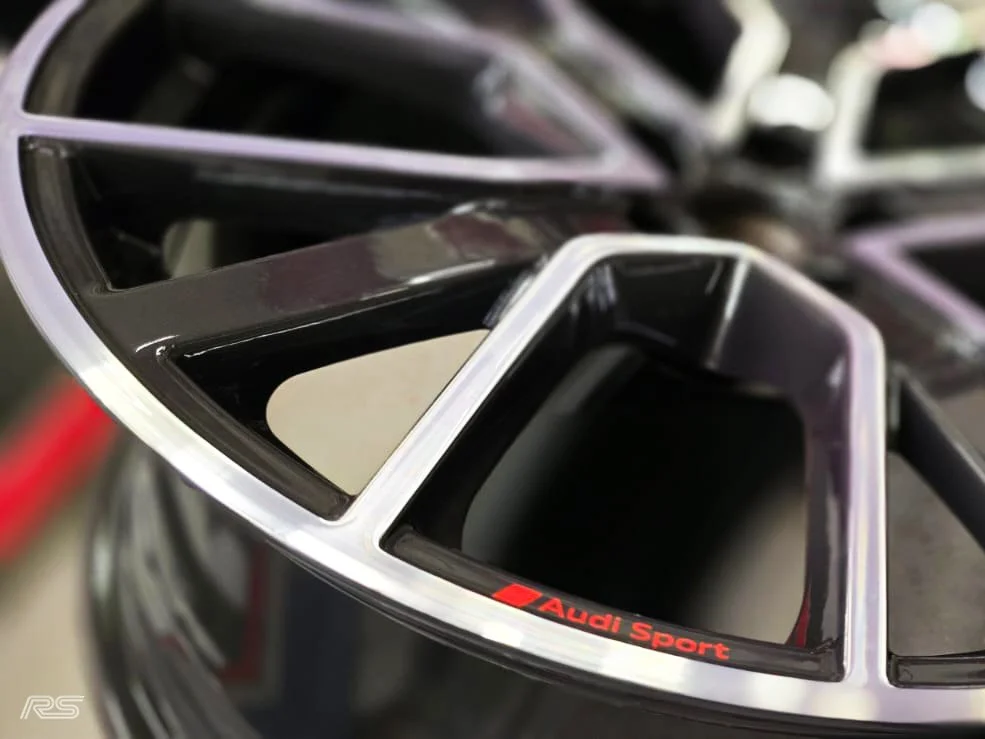 a close up shot of a wheel that has been diamond cut and it waiting a clear coating