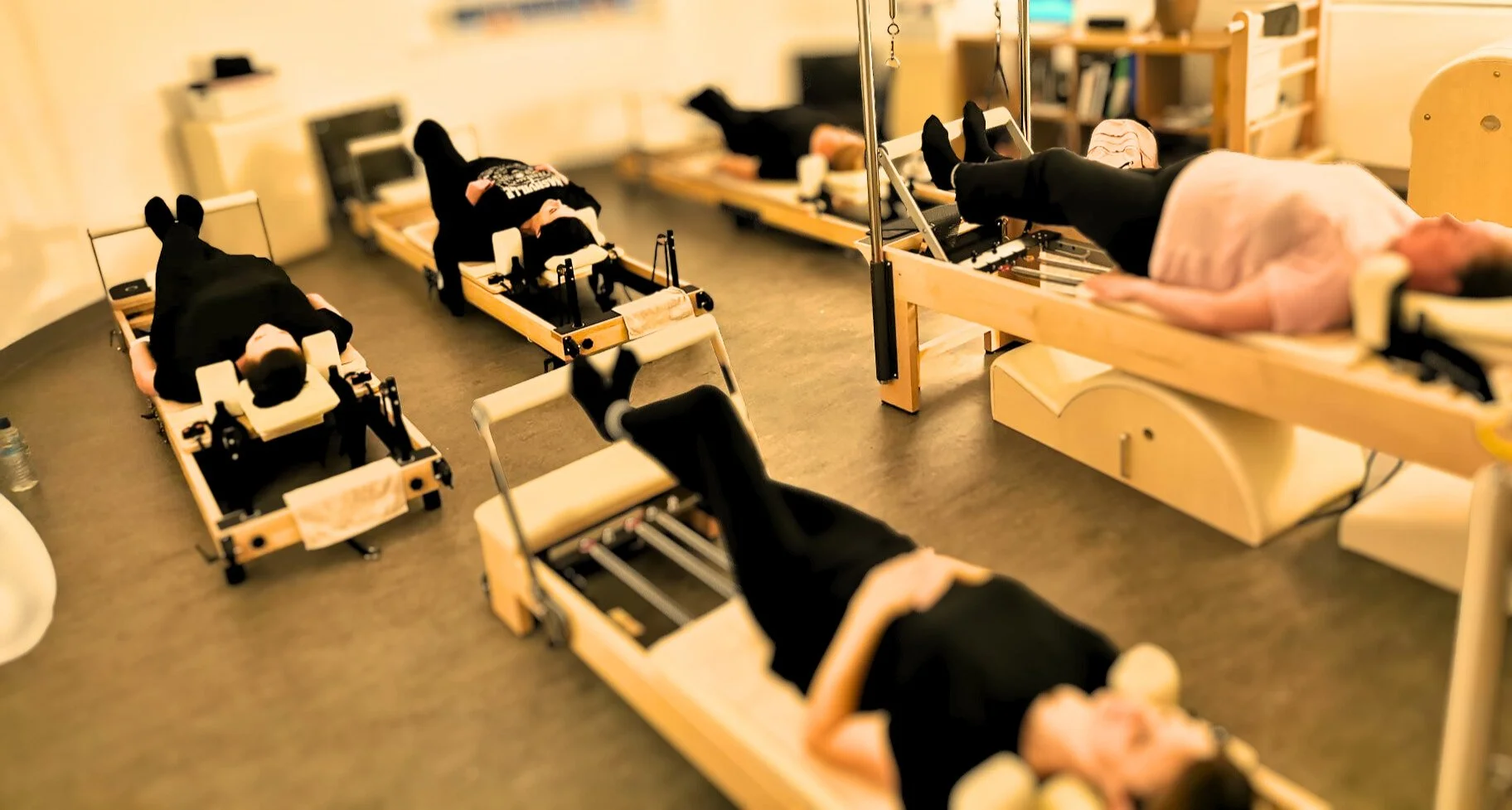 Small group Comprehensive Reformer Pilates class at Studio Di Rosa in Shankill, Dublin, combining Reformer and Pilates equipment for a varied full-body practice.