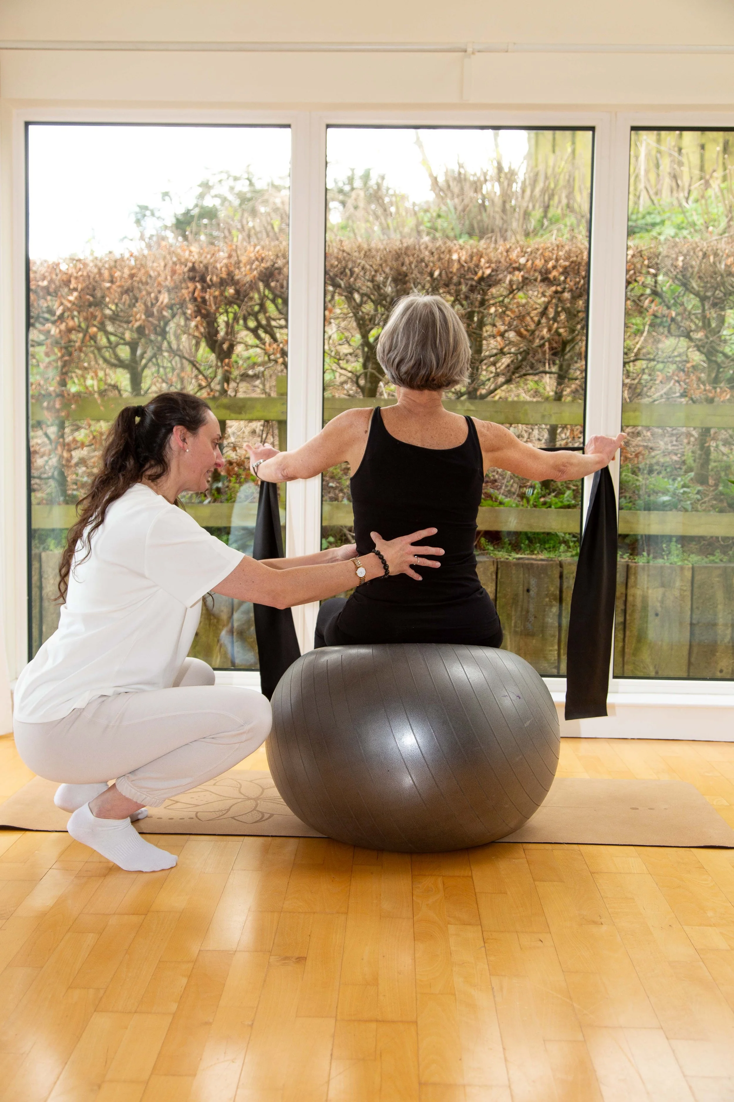 One-to-one Pilates session at Studio Di Rosa in Shankill, Dublin, with personalised instructor guidance using a stability ball.
