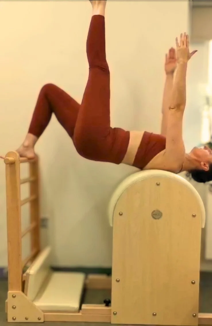 Pilates Barrel exercise at Studio Di Rosa in Shankill, Dublin, supporting spinal mobility, core control and balanced movement.