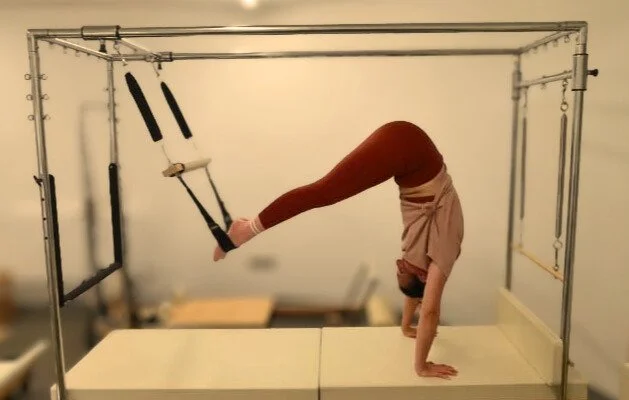 Pilates Cadillac exercise at Studio Di Rosa in Shankill, Dublin, demonstrating advanced strength, stability and full-body control.